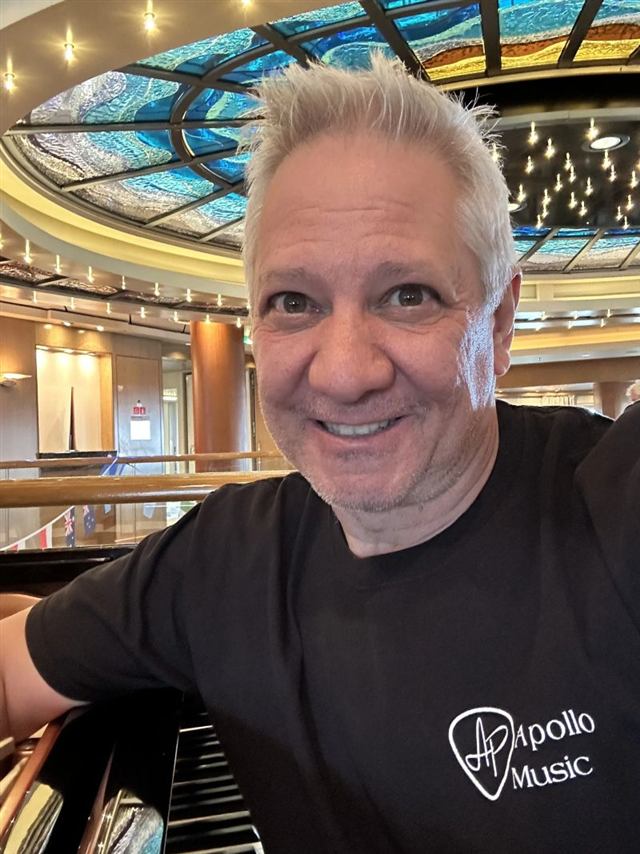 Vince, founder of SF Piano Works, seated at a grand piano